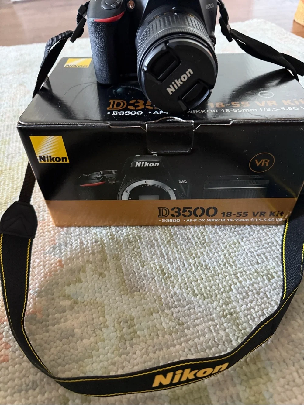 Nikon Black DSLR with 18-55mm Lens and Branded Strap